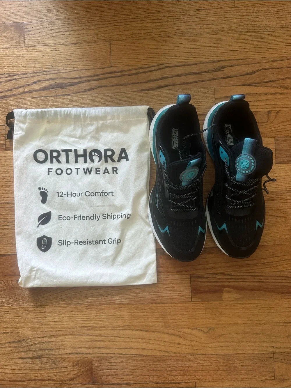 Orthora Black Sneakers with Teal Accents
